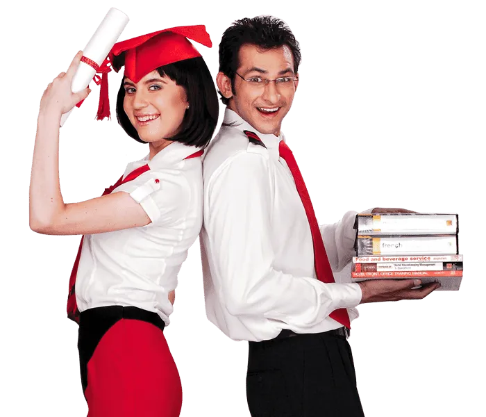 A woman and a man standing with their degree and books